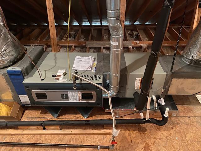 Technician servicing a furnace